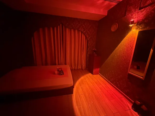Intimate massage room with warm ambient lighting at Opaline Spa Dubai