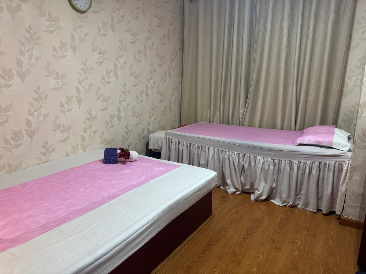 Twin massage beds in a treatment room at Opaline Spa Dubai